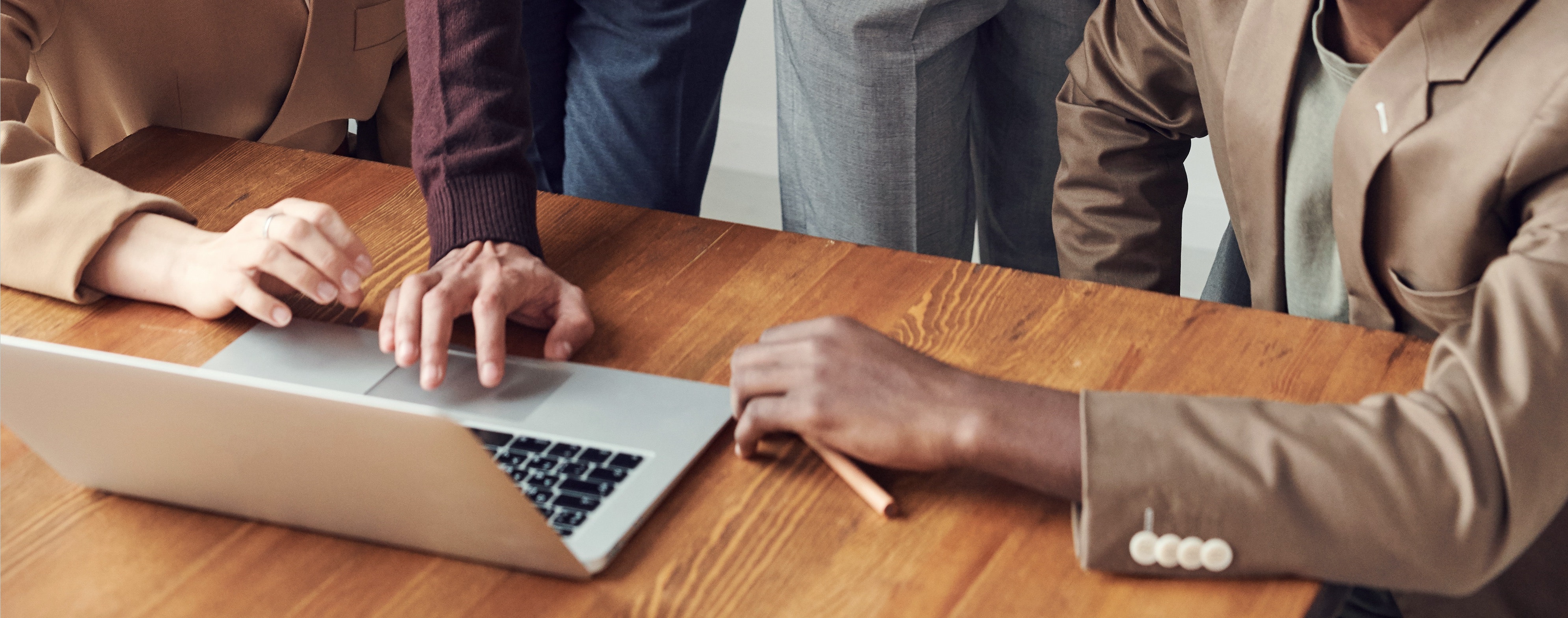 people working together around a computer