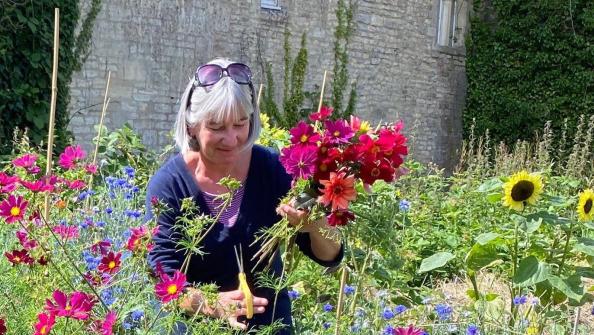 Woman church garden flowers smile.jpg